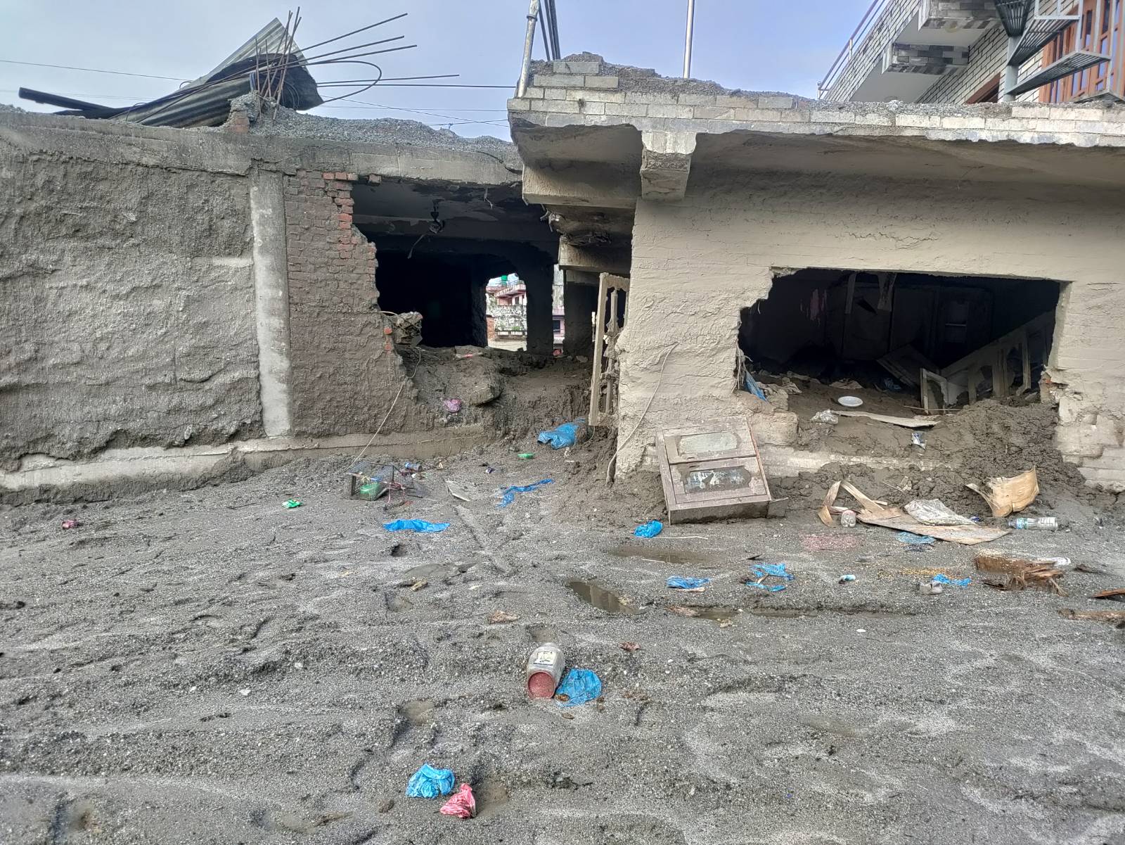Buildings damaged by flooding in northern Nepal